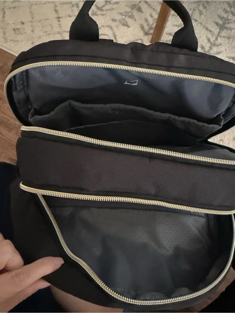 Amazon Black Quilted Backpack with Gold Accents